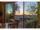 View of backyard and sunset through sliding glass doors at 4549 E Marion Way, Phoenix, AZ 85018