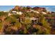 House nestled on hillside with red rocks and city views at 4549 E Marion Way, Phoenix, AZ 85018