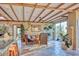 Open living area with high ceilings, exposed beams, and tile floors at 4549 E Marion Way, Phoenix, AZ 85018