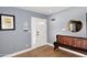 Bright entryway with wood floors and wooden bench at 3413 N 16Th N Dr, Phoenix, AZ 85015