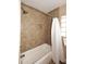 Bathroom with tub, shower, and white curtain at 3413 N 16Th N Dr, Phoenix, AZ 85015