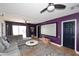 Media room with large screen, sectional sofa, and purple walls at 3413 N 16Th N Dr, Phoenix, AZ 85015