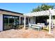 Brick patio with pergola, yellow bikes, and sliding glass doors at 3413 N 16Th N Dr, Phoenix, AZ 85015