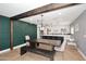 Bright dining area with a rustic wooden table and bench, and an accent wall at 3413 N 16Th N Dr, Phoenix, AZ 85015