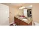 Bathroom with granite double vanity and large mirror at 3413 N 16Th N Dr, Phoenix, AZ 85015