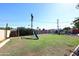 Spacious backyard with grassy area and playset at 3413 N 16Th N Dr, Phoenix, AZ 85015