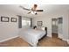Bedroom with a queen bed, ceiling fan, and wood-look flooring at 3413 N 16Th N Dr, Phoenix, AZ 85015