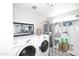 Laundry room with washer, dryer, and built-in storage at 3413 N 16Th N Dr, Phoenix, AZ 85015