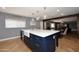 Kitchen island with white quartz countertops and a farmhouse sink at 3413 N 16Th N Dr, Phoenix, AZ 85015
