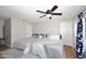 Bedroom with two twin beds, ceiling fan and light gray walls at 3413 N 16Th N Dr, Phoenix, AZ 85015