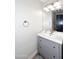 Small bathroom with gray vanity, white sink, and large mirror at 3413 N 16Th N Dr, Phoenix, AZ 85015