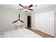 Bright bedroom with wood floors, ceiling fan, and large closet at 3413 N 16Th N Dr, Phoenix, AZ 85015