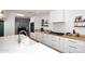 Modern kitchen with white cabinets, butcher block countertops, and a farmhouse sink at 3413 N 16Th N Dr, Phoenix, AZ 85015