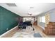 Living room with dark green accent wall and sectional sofa at 3413 N 16Th N Dr, Phoenix, AZ 85015