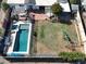Aerial view showing a home with a pool, grassy backyard, and playset at 3413 N 16Th N Dr, Phoenix, AZ 85015