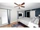 Main bedroom with a queen bed, ceiling fan, and access to the backyard at 3413 N 16Th N Dr, Phoenix, AZ 85015
