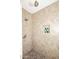 Clean shower with beige tile, a built-in shelf, and dual shower heads at 3413 N 16Th N Dr, Phoenix, AZ 85015
