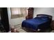 Bedroom with a double bed and wooden dresser at 2616 N 50Th Ave, Phoenix, AZ 85035