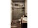 Updated bathroom with glass shower and granite vanity at 2616 N 50Th Ave, Phoenix, AZ 85035