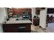 Kitchen with dark wood cabinets and granite countertops at 2616 N 50Th Ave, Phoenix, AZ 85035