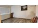 Bright spare room with wood flooring and large window at 2616 N 50Th Ave, Phoenix, AZ 85035