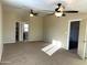 Spacious main bedroom with carpeted floors and ceiling fans at 414 E 5Th St, Eloy, AZ 85131