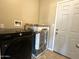 Laundry room with washer, dryer and access door at 414 E 5Th St, Eloy, AZ 85131