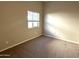 Bright bedroom with carpet and window coverings at 414 E 5Th St, Eloy, AZ 85131