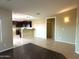Open dining area with wood-look floors and kitchen views at 414 E 5Th St, Eloy, AZ 85131