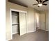 Bedroom with double door closet and ceiling fan at 414 E 5Th St, Eloy, AZ 85131