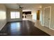Spacious living room with dark wood-look floors at 414 E 5Th St, Eloy, AZ 85131