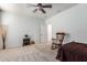 Spacious bedroom with ceiling fan and rocking chair at 7309 W Carter Rd, Laveen, AZ 85339