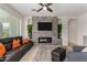 Living room featuring a modern fireplace and large TV at 17863 E Paria Canyon Dr, Rio Verde, AZ 85263