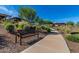 Landscaped walking path with a bench, offering a tranquil community setting at 17863 E Paria Canyon Dr, Rio Verde, AZ 85263