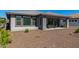 Charming backyard with gravel landscaping and a covered patio at 17863 E Paria Canyon Dr, Rio Verde, AZ 85263