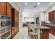 Open concept kitchen with island and breakfast bar, overlooking the living room at 2625 W Via Vis, Phoenix, AZ 85086