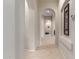 Elegant hallway with arched doorways and tiled flooring at 2625 W Via Vis, Phoenix, AZ 85086