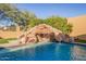 Close-up of a stunning waterfall feature in the pool at 8446 E Laurel St, Mesa, AZ 85207