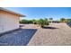 Large backyard with gravel and mature trees at 16828 N 108Th Ave, Sun City, AZ 85351