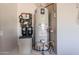 Interior view of a water heater and water softener system at 11705 W Red Hawk Dr, Peoria, AZ 85383