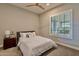 Serene bedroom with window shutters and ceiling fan at 11705 W Red Hawk Dr, Peoria, AZ 85383