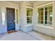 Dark-stained front door with sidelights and a welcome mat at 11705 W Red Hawk Dr, Peoria, AZ 85383