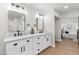 Stylish bathroom boasts double vanity, and a view into the bedroom at 454 E Hackamore St, Mesa, AZ 85203