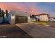 Attached garage with modern door and driveway at 454 E Hackamore St, Mesa, AZ 85203