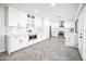 Modern kitchen with white cabinets and marble countertops at 408 E Claremont St, Phoenix, AZ 85012