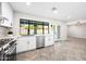 Bright kitchen with stainless steel appliances and herringbone floors at 408 E Claremont St, Phoenix, AZ 85012