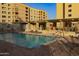 Relaxing community pool with patio furniture at 7920 E Camelback Rd # 509, Scottsdale, AZ 85251