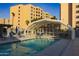 Heated pool with covered seating area and lounge chairs at 7920 E Camelback Rd # 509, Scottsdale, AZ 85251