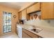 Kitchen features wood cabinets and a window overlooking the pool at 5203 N 24Th St # 206, Phoenix, AZ 85016