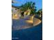 Evening view of backyard patio with lighting at 18320 N Las Rocas Way, Surprise, AZ 85374